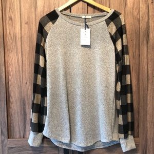 Ragland style sweater with plaid sleeves